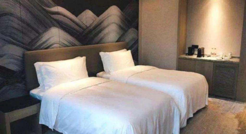 Bed in Yinhu Junyi Hotel（Wildlife Park）