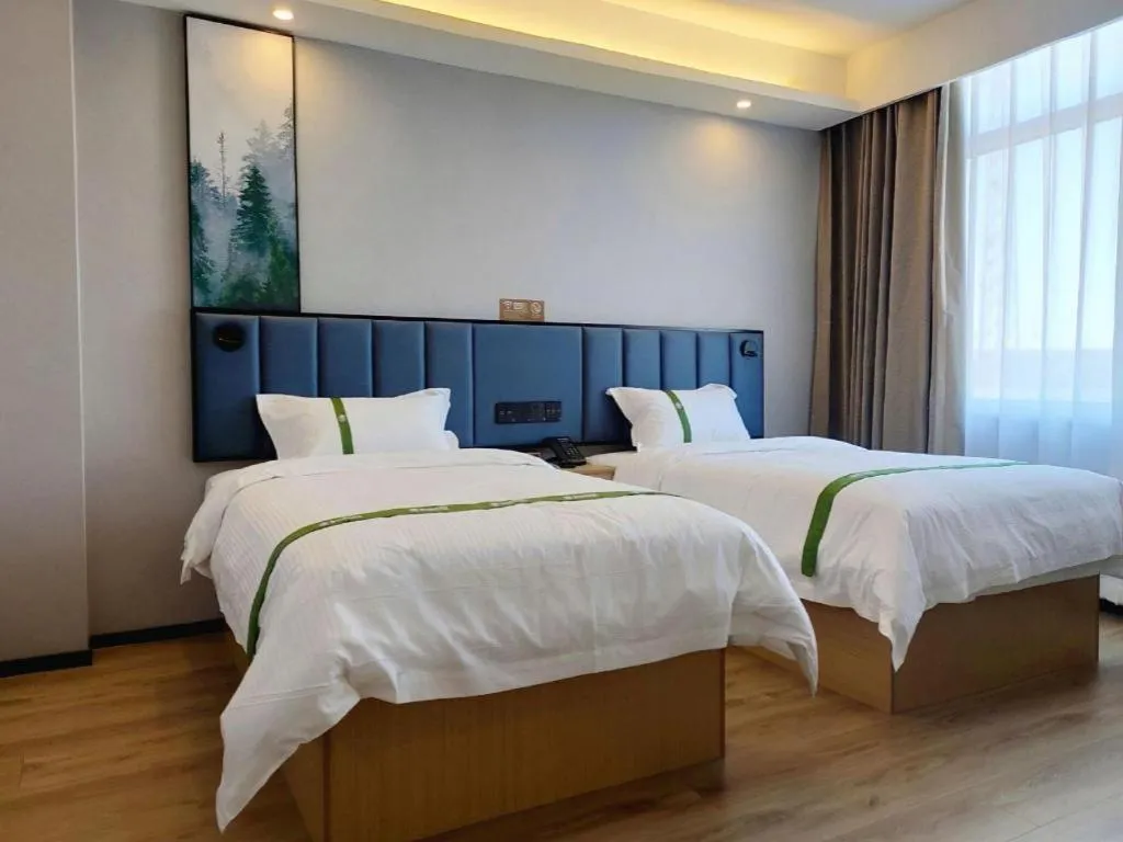 Bed in GreenTree Inn Express Qingdao Jiaodong International Airport