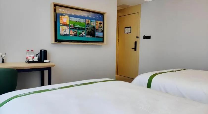 Bed in GreenTree Inn Express Qingdao Jiaodong International Airport