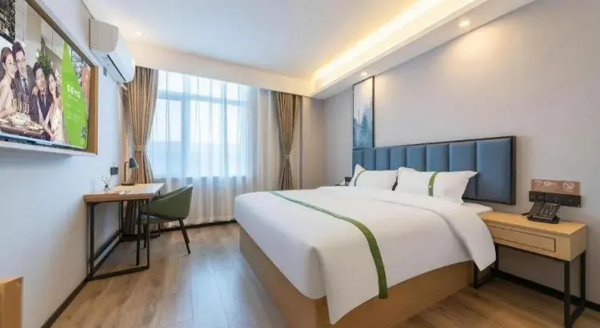 Bed in GreenTree Inn Express Qingdao Jiaodong International Airport Bed in GreenTree Inn Express Qingdao Jiaodong International Airport