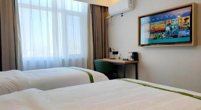 Bed in GreenTree Inn Express Qingdao Jiaodong International Airport