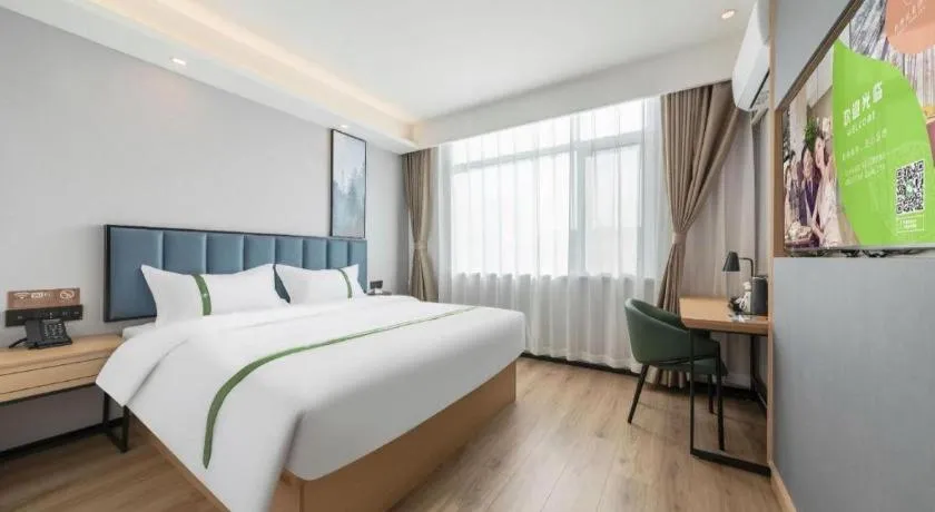 Bed in GreenTree Inn Express Qingdao Jiaodong International Airport