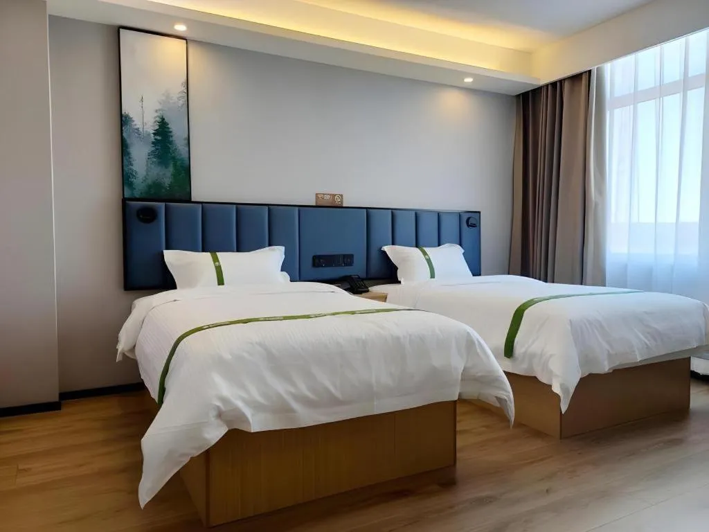 Bed in GreenTree Inn Express Qingdao Jiaodong International Airport