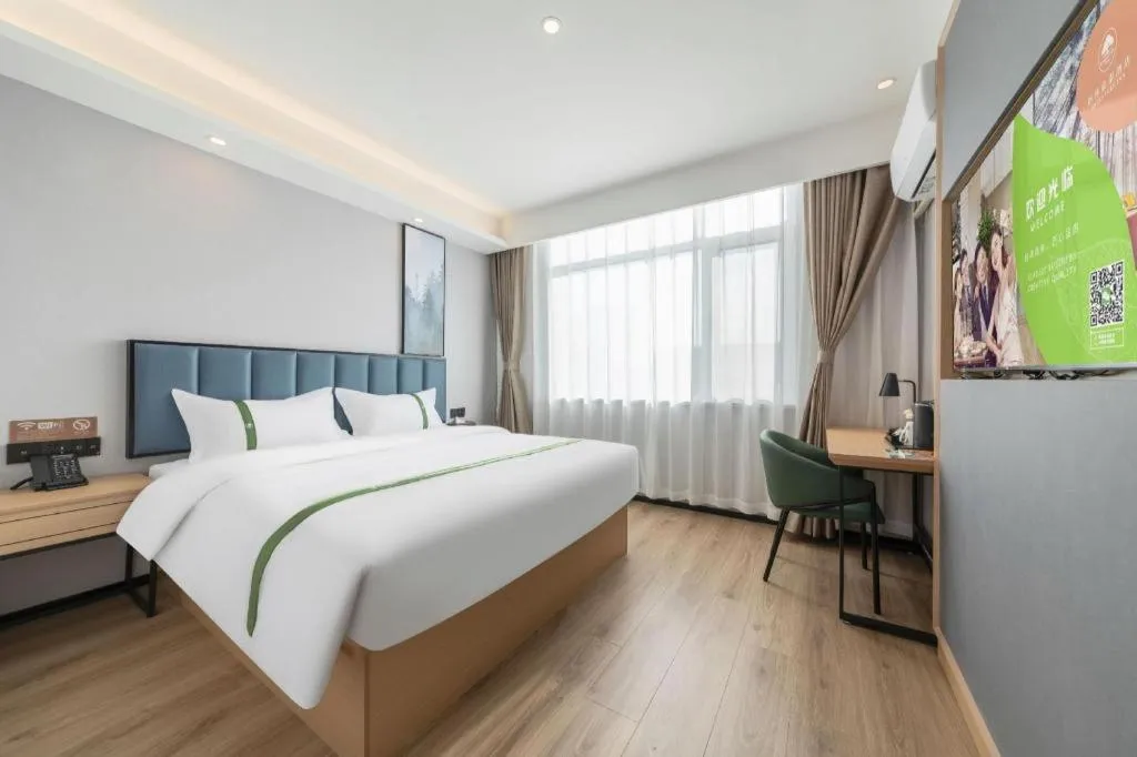 Bed in GreenTree Inn Express Qingdao Jiaodong International Airport