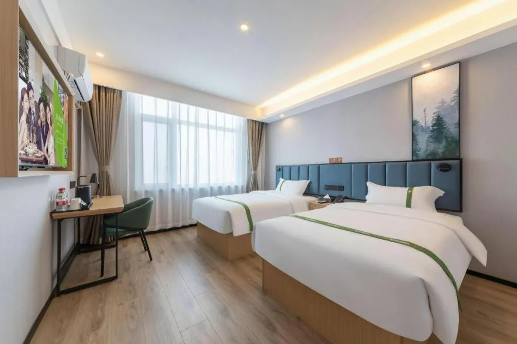 Bed in GreenTree Inn Express Qingdao Jiaodong International Airport