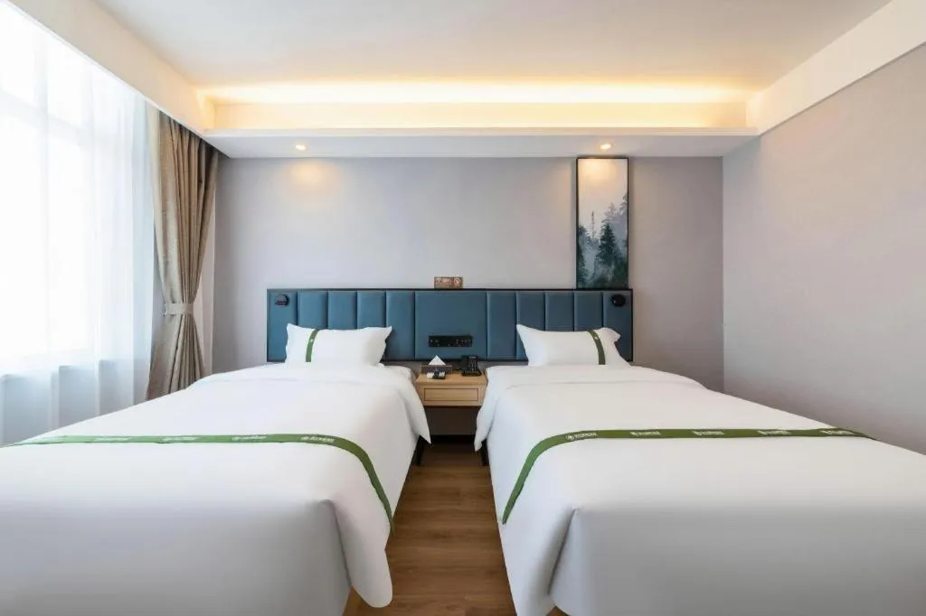 Bed in GreenTree Inn Express Qingdao Jiaodong International Airport