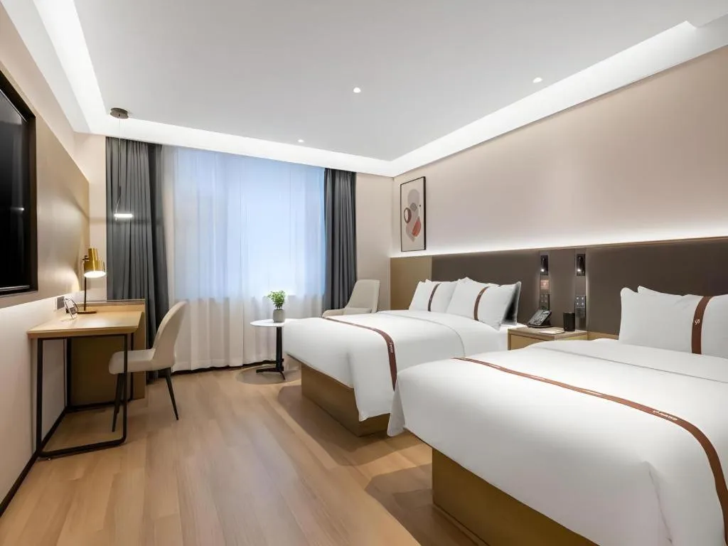 Bed in GYA Hotel Taiyuan Jinyang Street Grand Shanxi Hospital