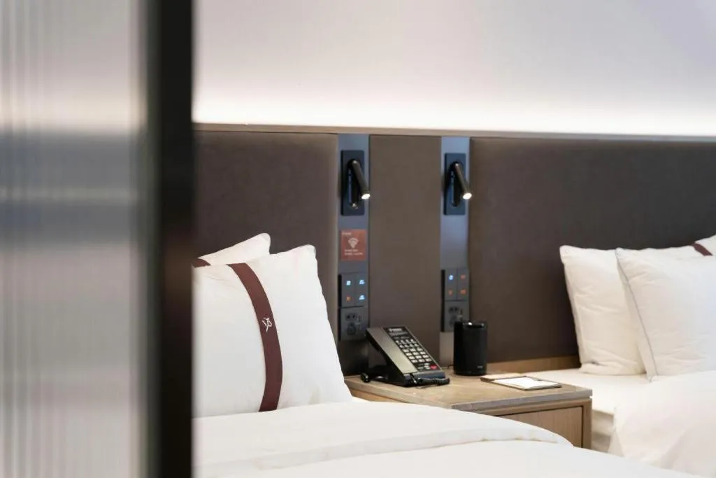 Bed in GYA Hotel Taiyuan Jinyang Street Grand Shanxi Hospital