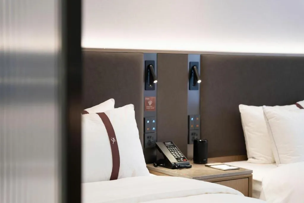 Bed in GYA Hotel Taiyuan Jinyang Street Grand Shanxi Hospital