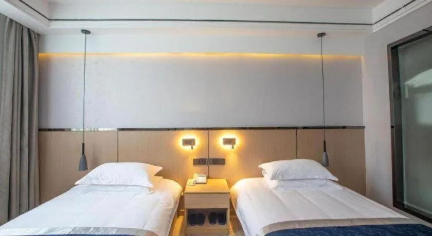 Bed in GELI Hotel Huainan Railway Station Sports Center