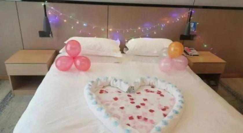 Bed in GELI Hotel Huainan Railway Station Sports Center