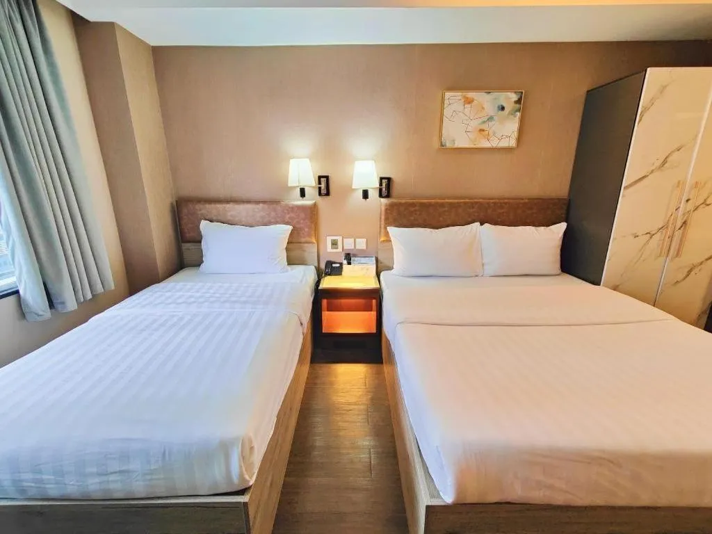 Bed in Sunny Day Hotel