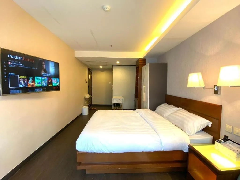 Bed in Sunny Day Hotel