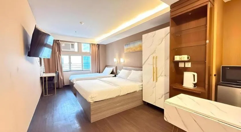 Bed in Sunny Day Hotel