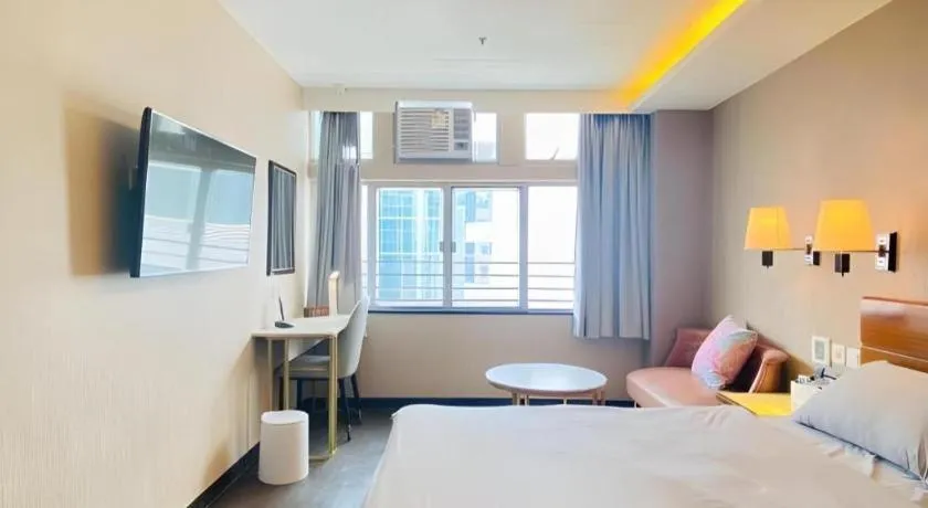 Bed in Sunny Day Hotel