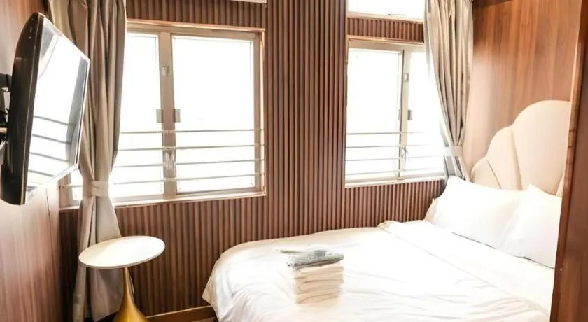 Bed in Sunny Day Hotel