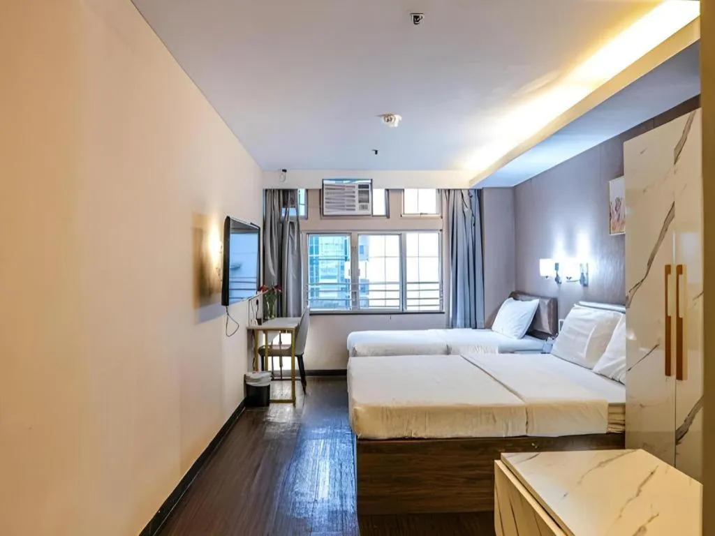 Bed in Sunny Day Hotel