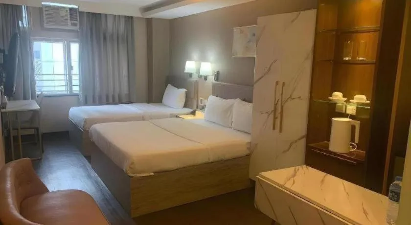 Bed in Sunny Day Hotel