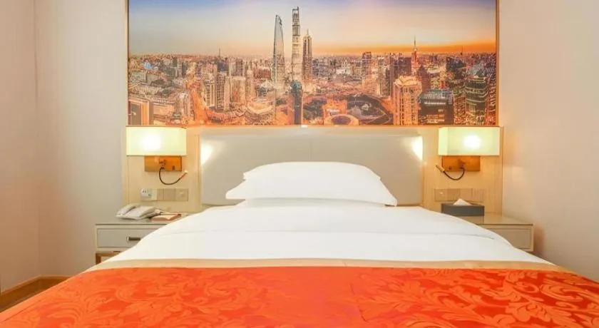 Bed in SHANGJINGHAO HOTEL （SAKATA SNOW ELEPHANT SUBWAY STATION SHOP）