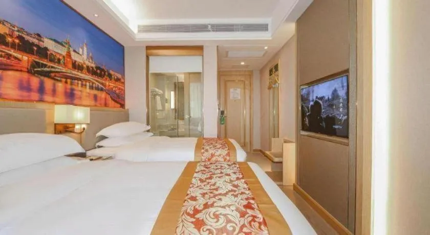 Bed in SHANGJINGHAO HOTEL （SAKATA SNOW ELEPHANT SUBWAY STATION SHOP）