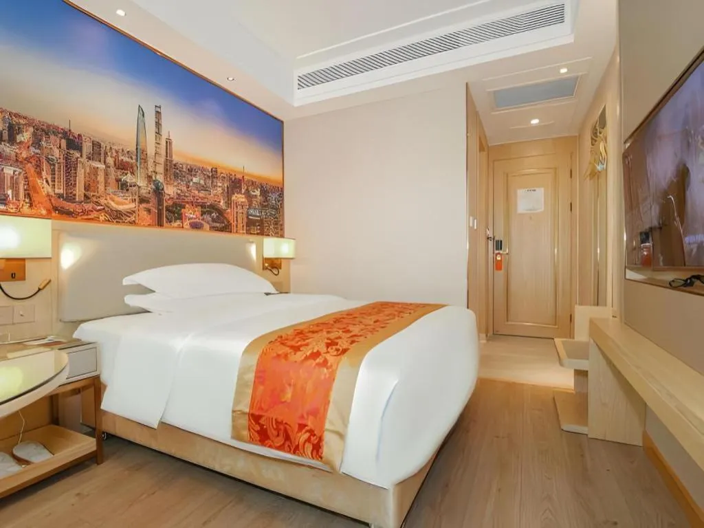 Bed in SHANGJINGHAO HOTEL （SAKATA SNOW ELEPHANT SUBWAY STATION SHOP）