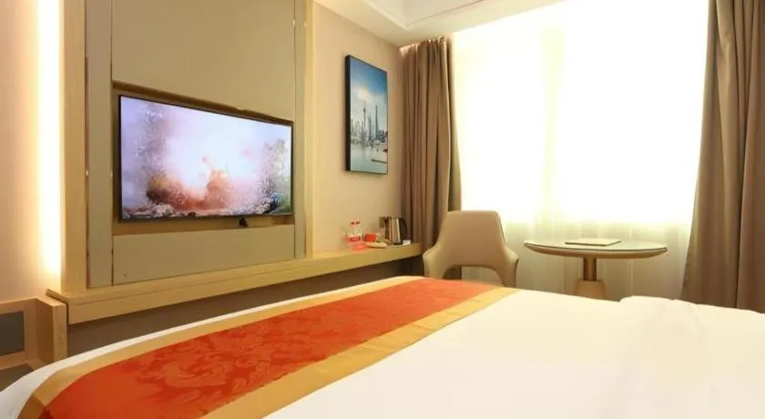 Bed in SHANGJINGHAO HOTEL （SAKATA SNOW ELEPHANT SUBWAY STATION SHOP）