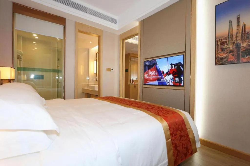 Bed in SHANGJINGHAO HOTEL （SAKATA SNOW ELEPHANT SUBWAY STATION SHOP）