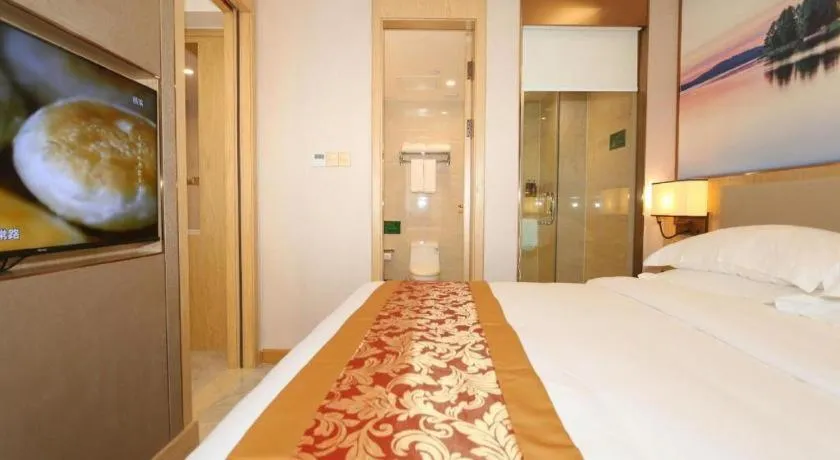 Bed in SHANGJINGHAO HOTEL （SAKATA SNOW ELEPHANT SUBWAY STATION SHOP）