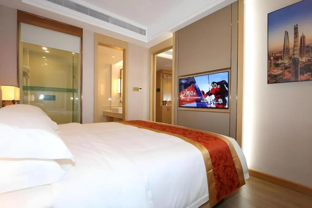 Bed in SHANGJINGHAO HOTEL （SAKATA SNOW ELEPHANT SUBWAY STATION SHOP）