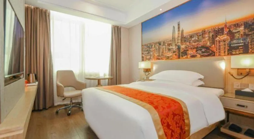 Bed in SHANGJINGHAO HOTEL （SAKATA SNOW ELEPHANT SUBWAY STATION SHOP）