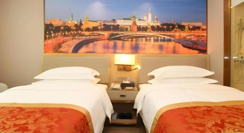 Bed in SHANGJINGHAO HOTEL （SAKATA SNOW ELEPHANT SUBWAY STATION SHOP）