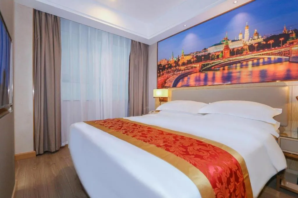 Bed in SHANGJINGHAO HOTEL （SAKATA SNOW ELEPHANT SUBWAY STATION SHOP）