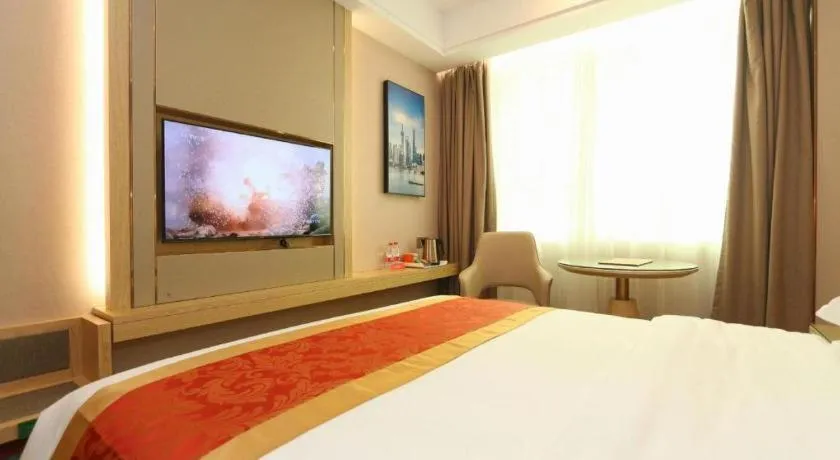 Bed in SHANGJINGHAO HOTEL （SAKATA SNOW ELEPHANT SUBWAY STATION SHOP）