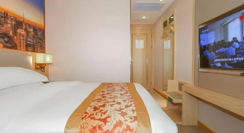 Bed in SHANGJINGHAO HOTEL （SAKATA SNOW ELEPHANT SUBWAY STATION SHOP）