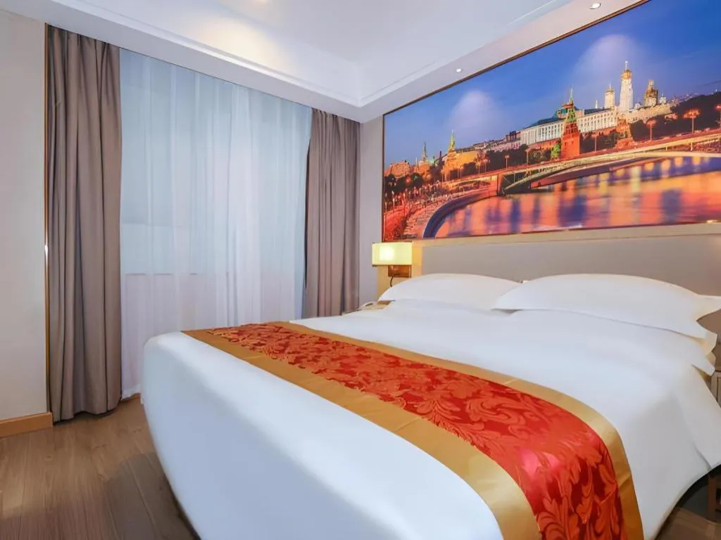 Bed in SHANGJINGHAO HOTEL （SAKATA SNOW ELEPHANT SUBWAY STATION SHOP）