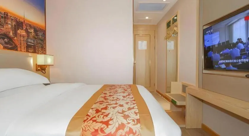 Bed in SHANGJINGHAO HOTEL （SAKATA SNOW ELEPHANT SUBWAY STATION SHOP）