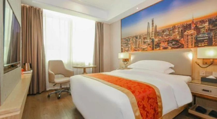 Bed in SHANGJINGHAO HOTEL （SAKATA SNOW ELEPHANT SUBWAY STATION SHOP）