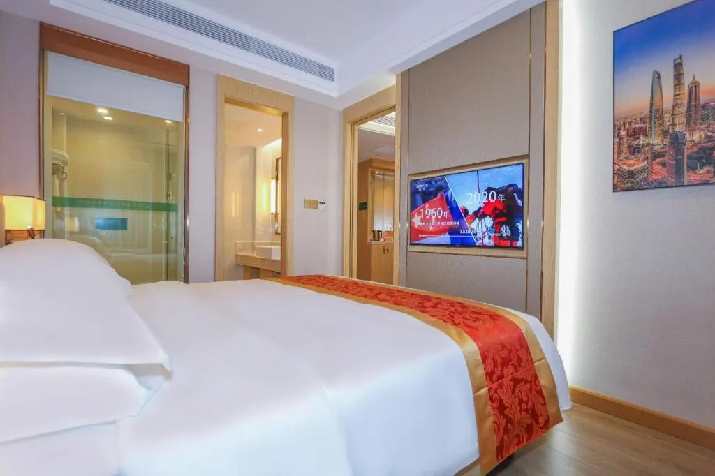 Bed in SHANGJINGHAO HOTEL （SAKATA SNOW ELEPHANT SUBWAY STATION SHOP）