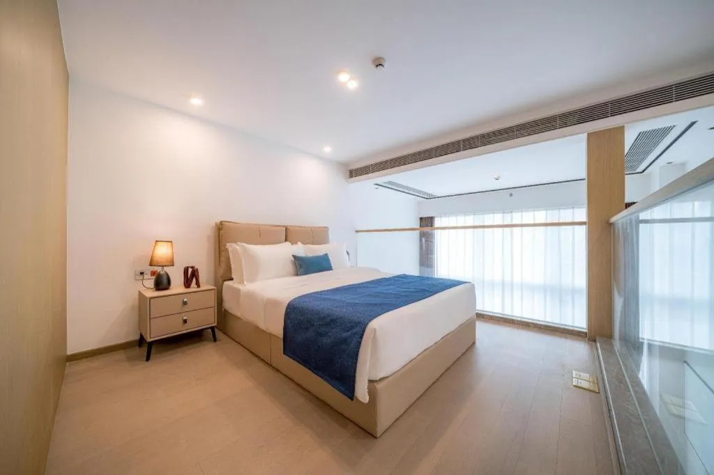 Bed in F-TOWN Fangtang Hotel (Shenzhen Longgang Tian'an Digital City Huanggekeng Subway Station)