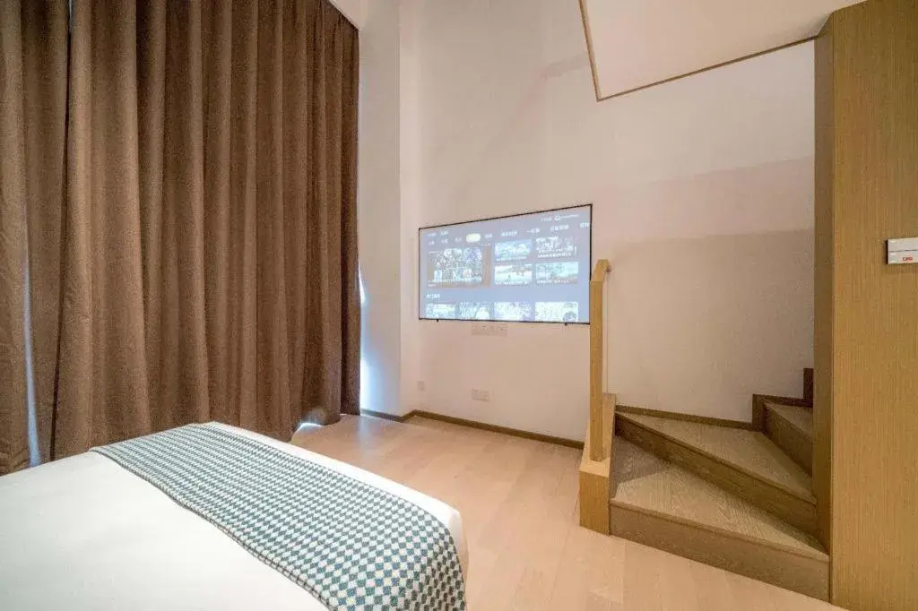 Bed in F-TOWN Fangtang Hotel (Shenzhen Longgang Tian'an Digital City Huanggekeng Subway Station) Bed in F-TOWN Fangtang Hotel (Shenzhen Longgang Tian'an Digital City Huanggekeng Subway Station)