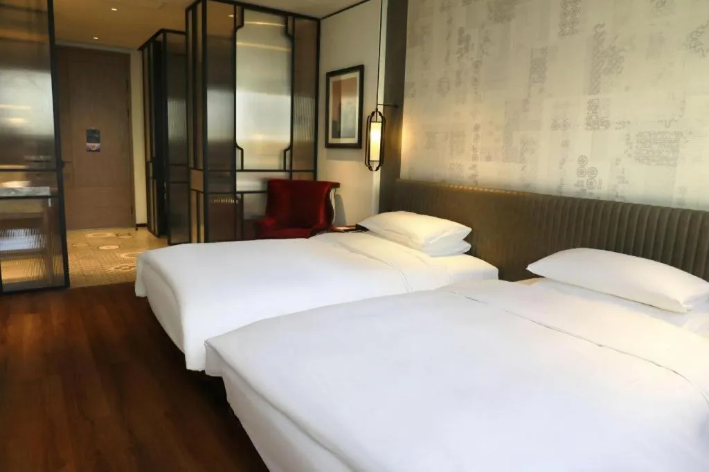 Bed in Mumian Rizhao Hotel