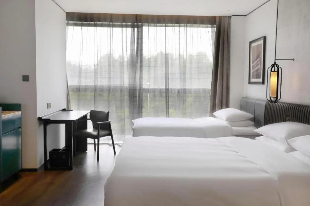 Bed in Mumian Rizhao Hotel