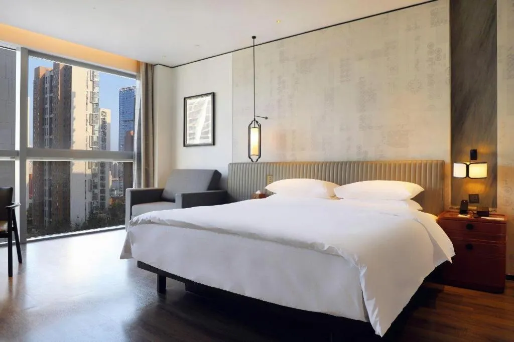 Bed in Mumian Rizhao Hotel