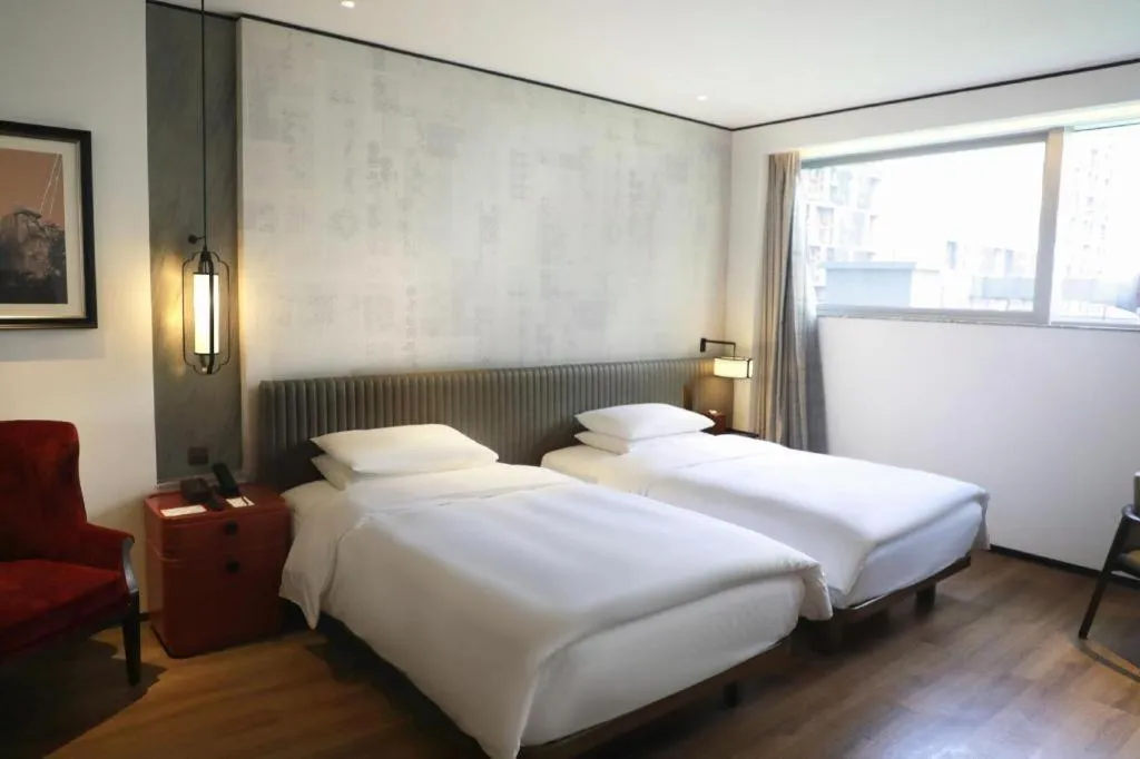 Bed in Mumian Rizhao Hotel