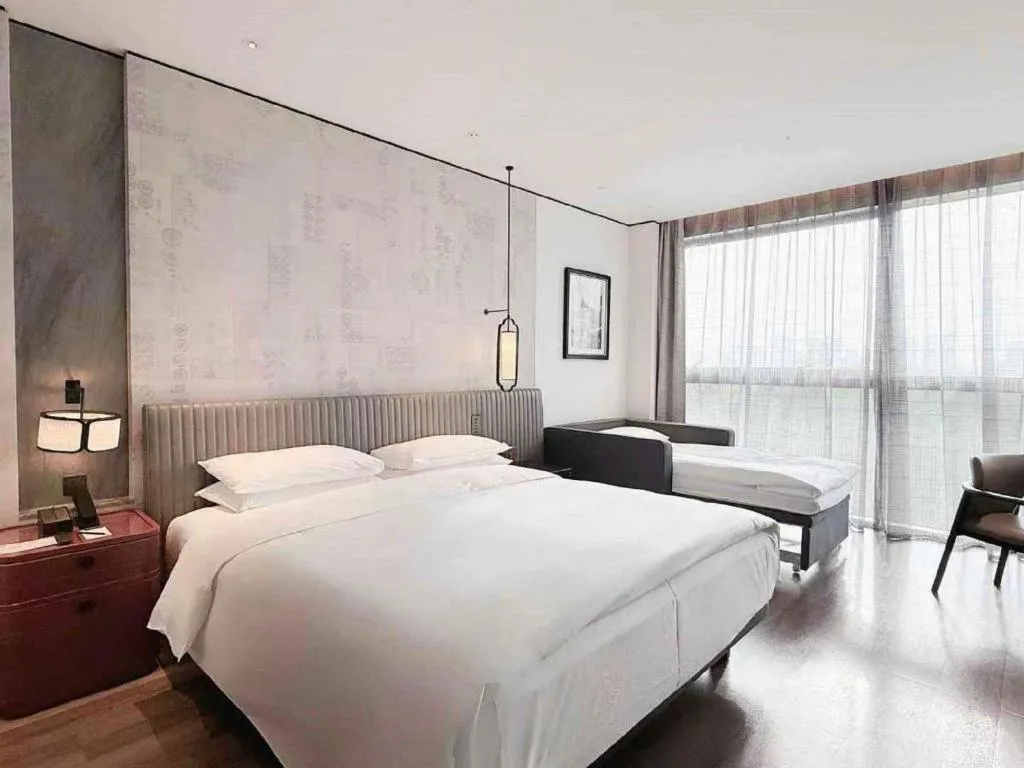 Bed in Mumian Rizhao Hotel