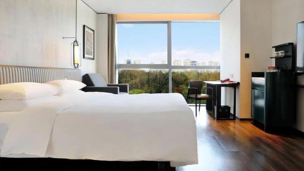 Bed in Mumian Rizhao Hotel