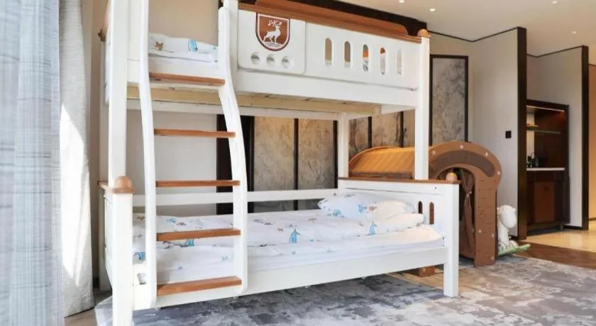 Bed in Mumian Rizhao Hotel