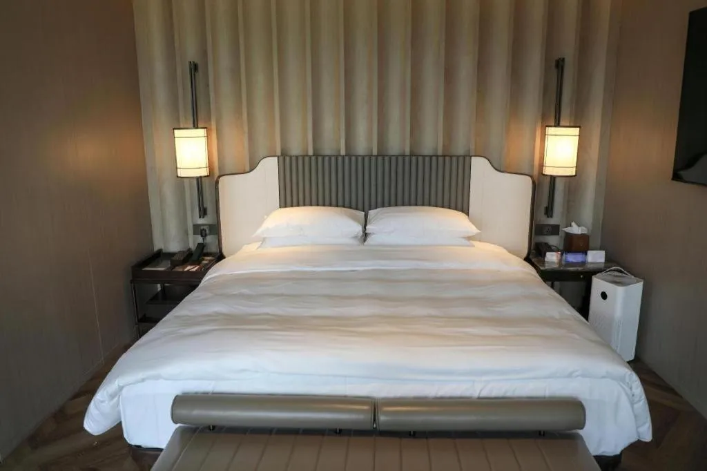 Bed in Mumian Rizhao Hotel