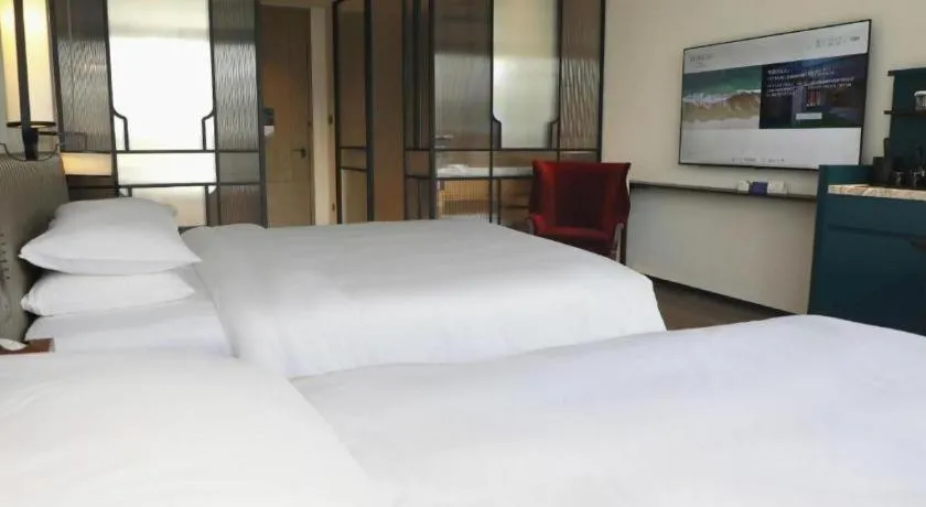 Bed in Mumian Rizhao Hotel
