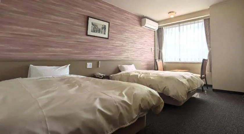 Bed in Mikuni Ocean Resort & Hotel